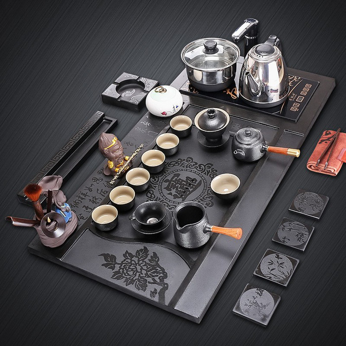 廠家直銷烏金石茶盤套裝 四合一設(shè)計(jì)帶電磁爐，家用茶臺(tái)定制新選擇